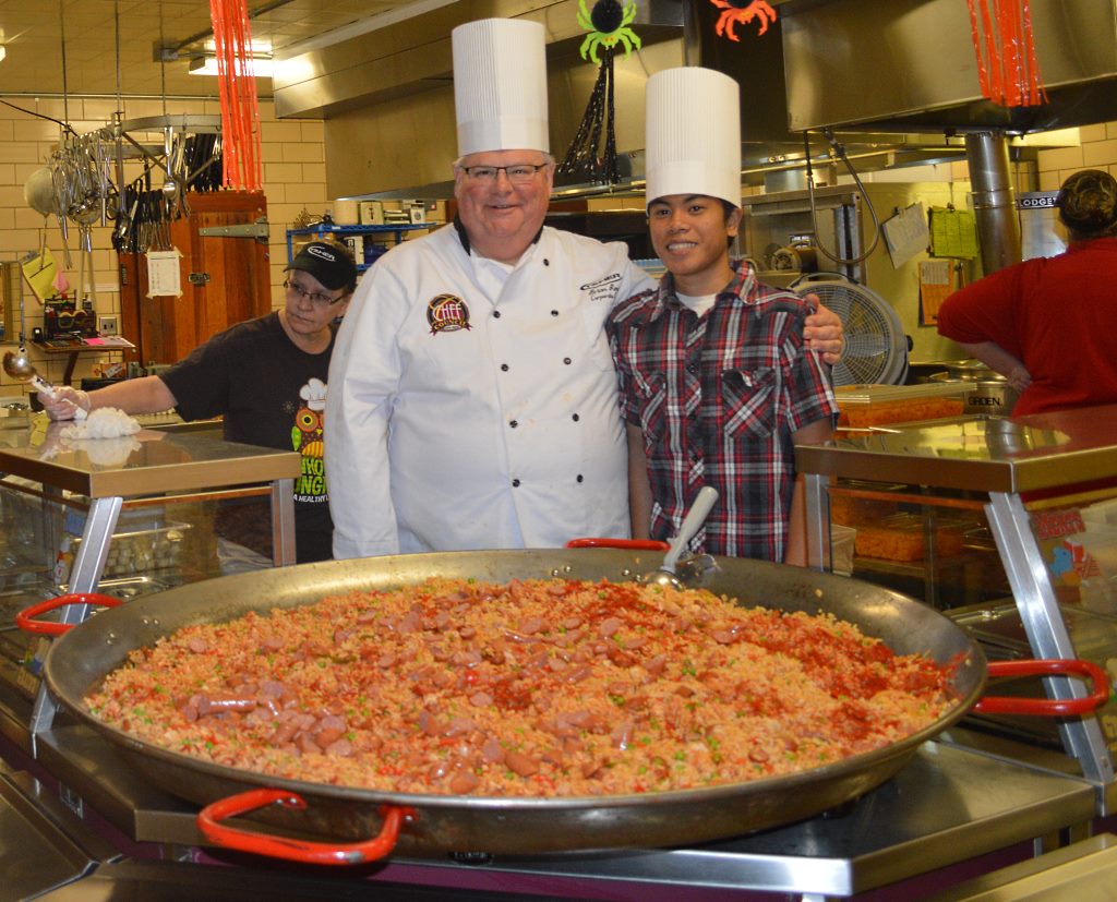 A PROUD MOMENT for the master chef and his prize student – Chef Brian and Louis Louangthilath – as well as their piece de resistance – the paella.
