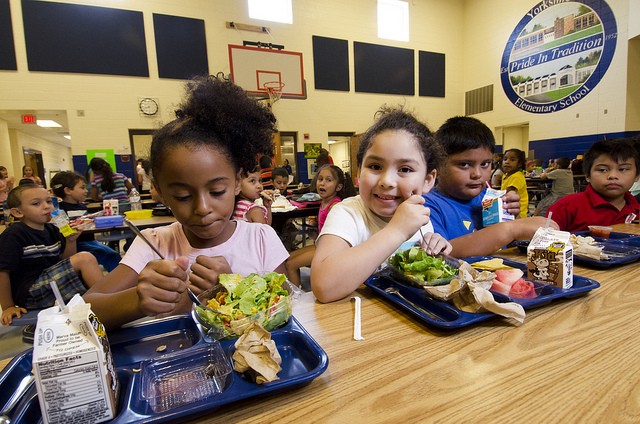American children eat almost half their lunches each year at school, so it’s a key place for encouraging healthy food habits. [Image credit: U.S. Department of Agriculture.]