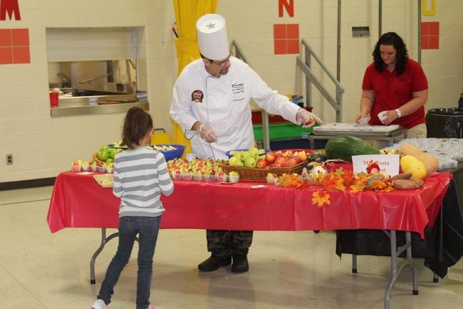 Chef Paul Booth, from Taher Food Services, and Abby Grove, food services coordinator for the school district, served up four different varieties of apples, as well as sweet potato harvest bars, at Northside Elementary School.