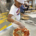 Ducombe 3rd grader Tyson Johnson making pizza
